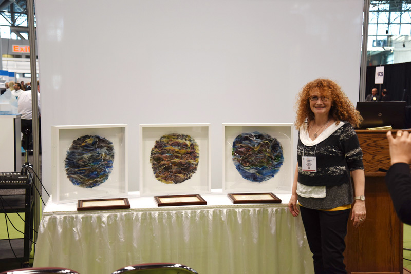 The Brooklyn-based artist Etty Yaniv with the artworks she created for the winners.